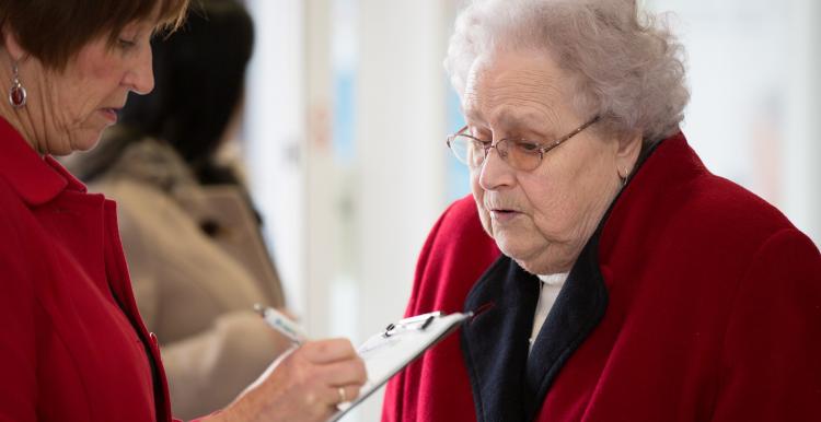 Elderly lady taking survey Elderly lady taking survey