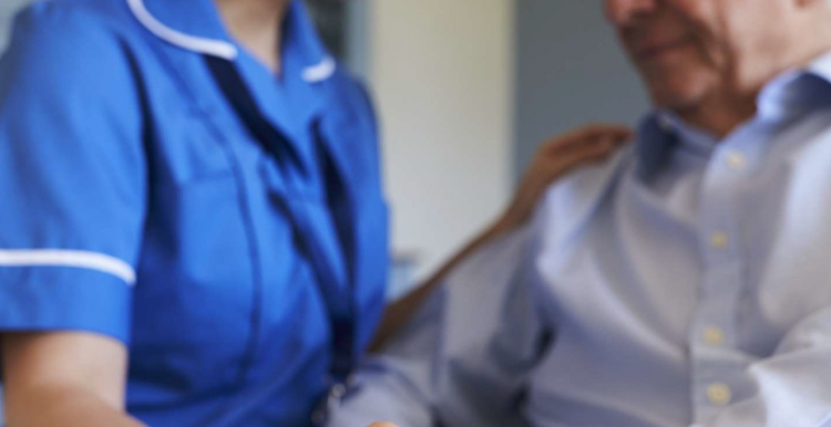 Man and caring hospital worker Man and caring hospital worker