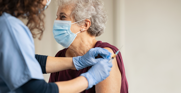 Lady receiving vaccine jab