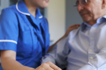 Man and caring hospital worker