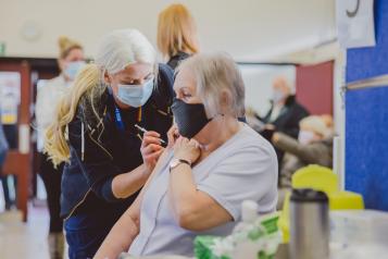 vaccine being given to woman