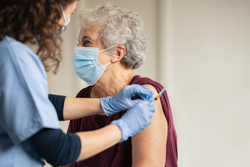 Lady receiving vaccine jab