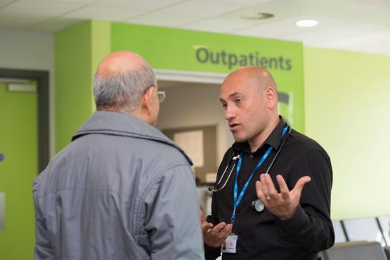 Volunteer talking to member of public